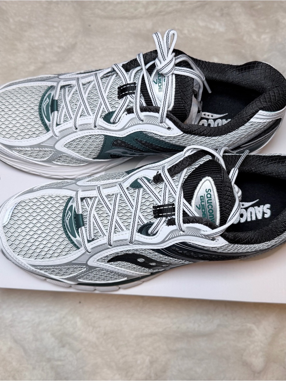 Saucony White Running Shoes with Teal & Black Accents